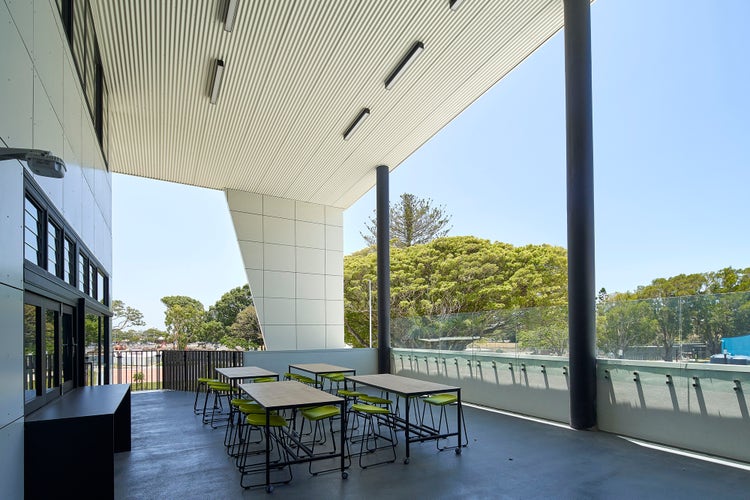 Large high-ceiling verandah with art tables