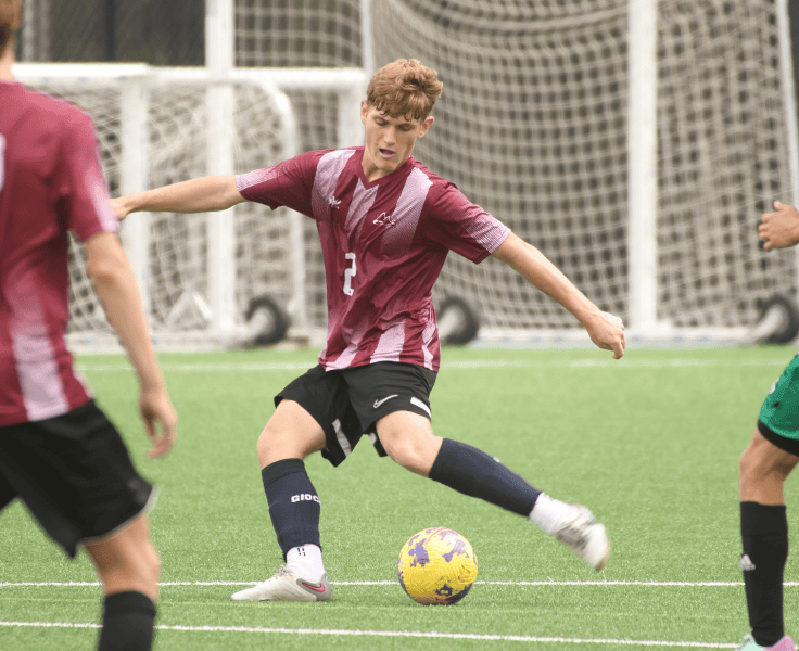 Action shot of male soccer player with ball